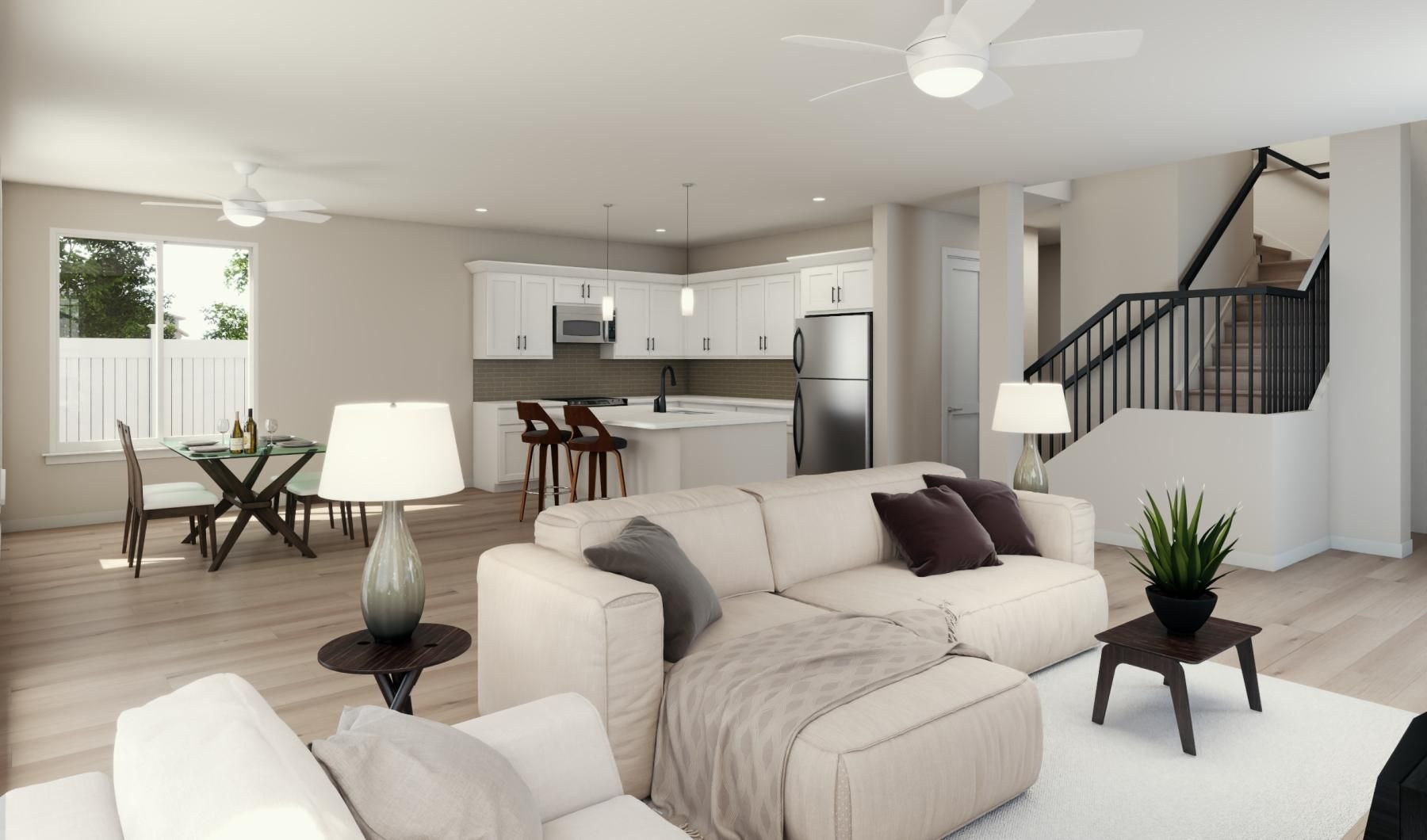 a living room with a large kitchen